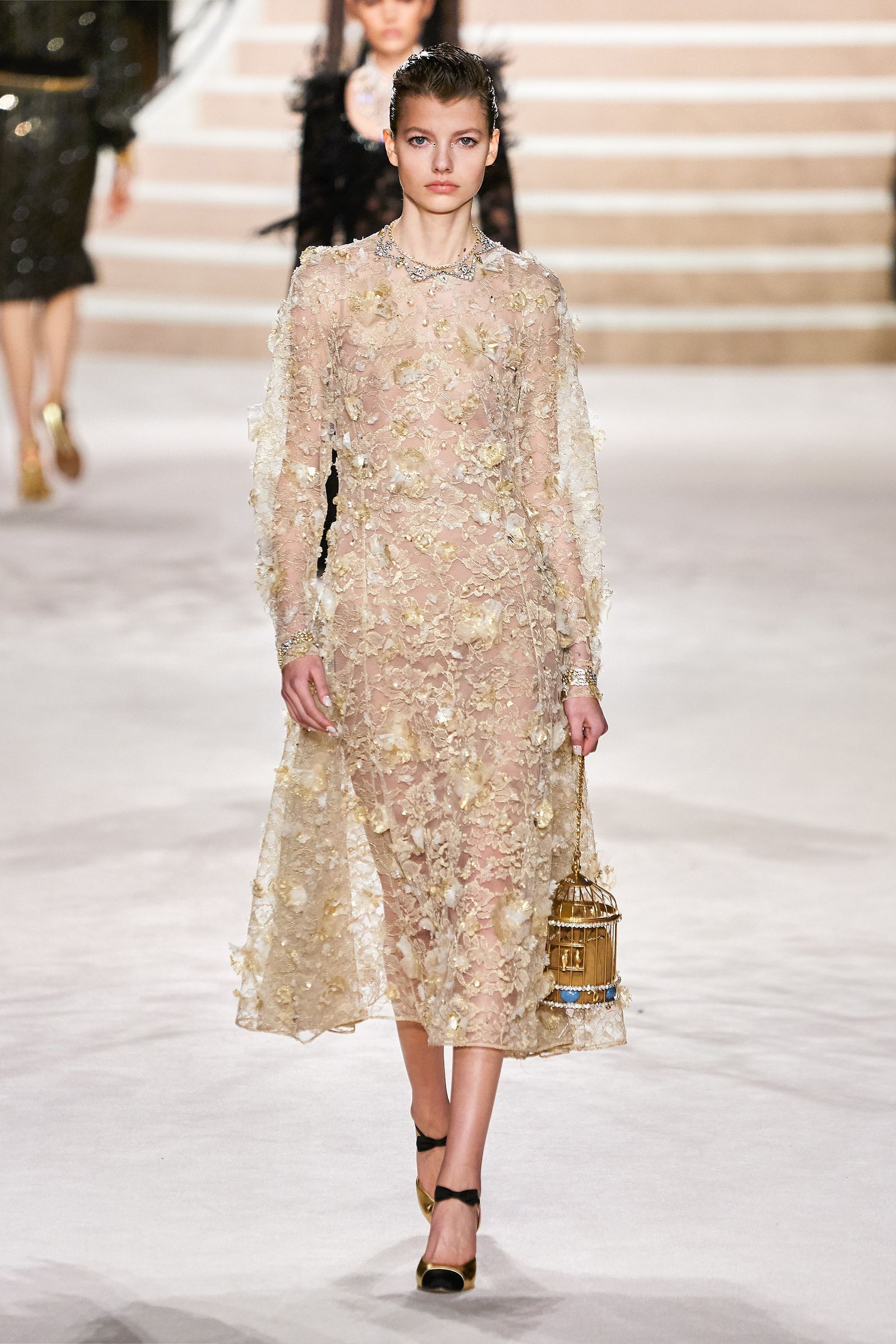 Image may contain Human Person Fashion Clothing Apparel Evening Dress Gown Robe and Runway