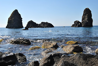 The dramatic rock formation off the coast at Aci Trezza is known as the Islands of the Cyclops The dramatic rock formation off the coast at Aci Trezza is known as the Islands of the Cyclops