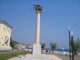 The Venetian column with its winged lion of St Mark on the waterfront of Salò on Lake Garda The Venetian column with its winged lion of St Mark on the waterfront of Salò on Lake Garda