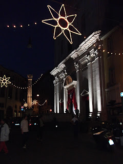 The Chiesa di Sant'Alessandro in Colonna lit up for the Festa along with the Roman column The Chiesa di Sant'Alessandro in Colonna lit up for the Festa along with the Roman column