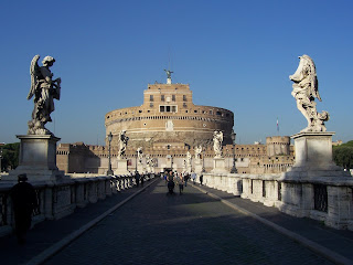 Rome's cylindrical Castel Sant' Angelo seen across the bridge over the Tiber river Rome's cylindrical Castel Sant' Angelo seen across the bridge over the Tiber river