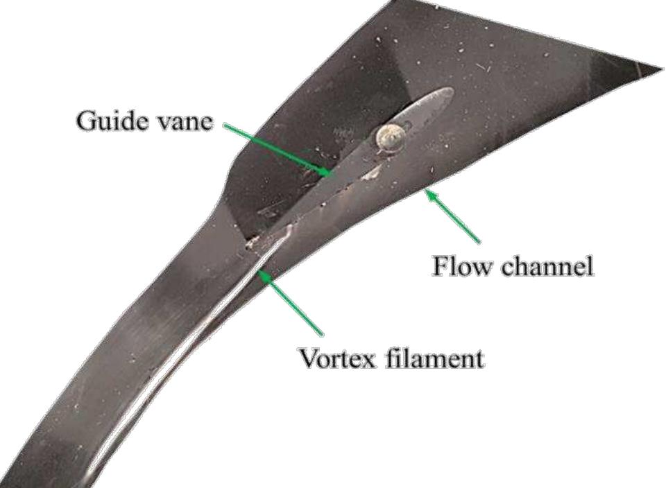 Figure 10. Observation of vortex filament from clearance gap  I EI IEEE EE  Figure 11 shows the results of PIV measurements at the plane middle of 2 mm clearance gap. Contours of total velocity together with the velocity vectors can be observed. Close to the leading edge velocity vectors are close to that of main stream flow both in magnitude and direction. Stagnation of flow by the GV shaft can also be seen. Behind the GV shaft gradual development of crossflow and its mixing with main stream flow can be observed. As also indicated by the pressure measurements, the highest amount of crossflow, both in magnitude and direction, occurs at 60-70% of chord length. Mixing of cross flow with main flow seen in Figure 11 justifies the formation and development of vortex filament as observed in Figure 10.  