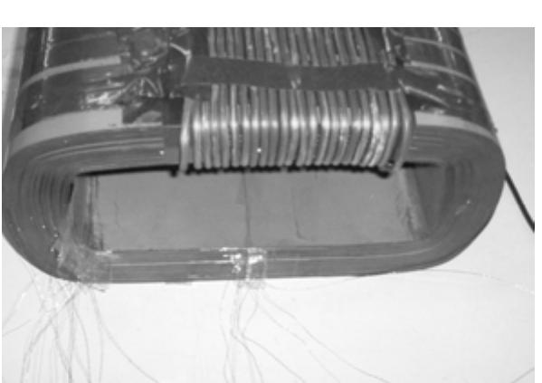Fig. 3. Detail of the wound core, the excitation coil, and the search coils.  Fig. 2. Experimental setup. 