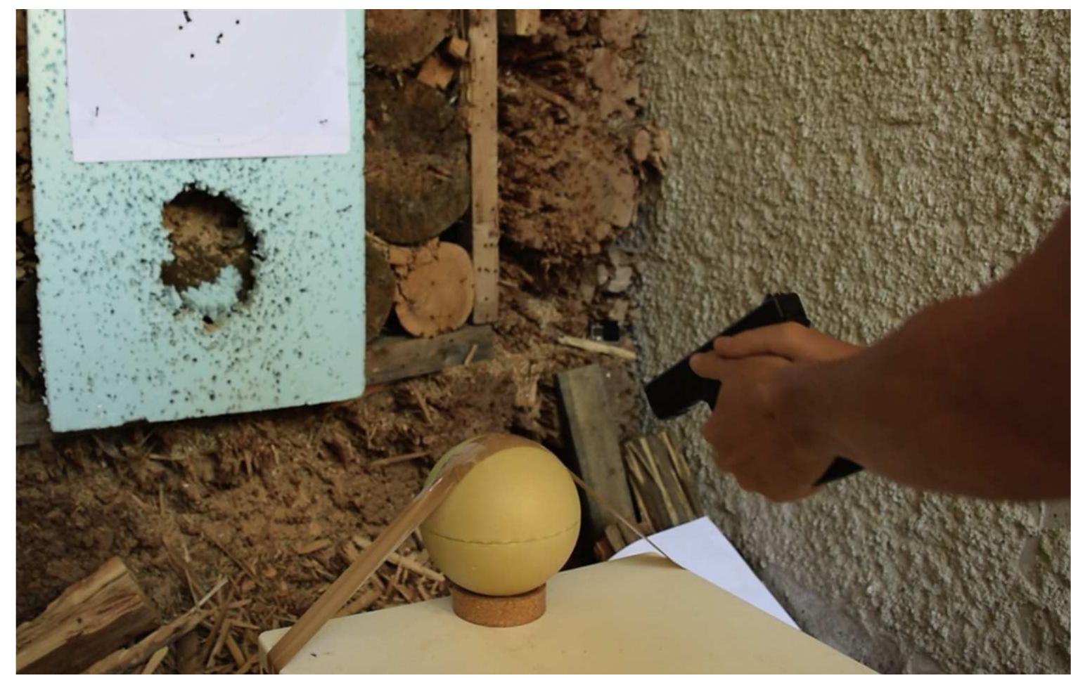 Fig. 2. Experimental setting: The Synbone™ spheres were placed on a cork ring and taped with one strand of packing tape to secure them to the table. 
