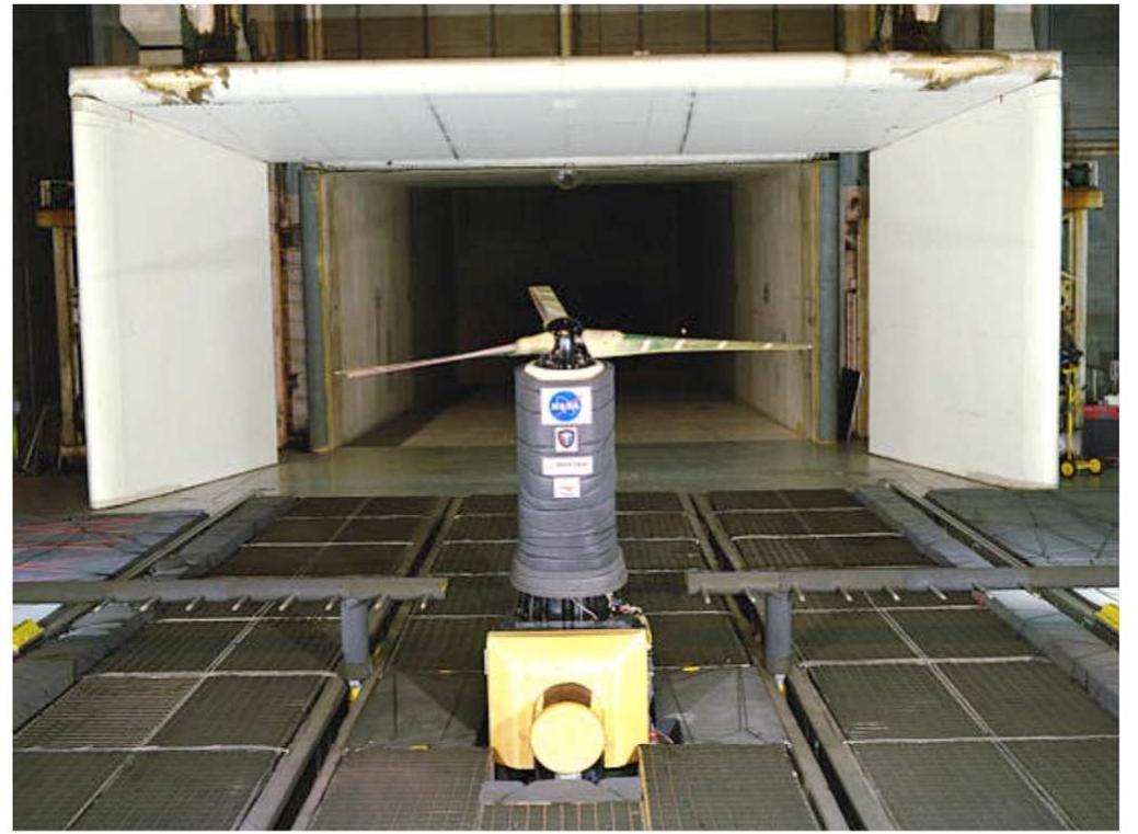 To meet the needs of the ERA AT and VSI subprojects, a new aeroacoustic measurement capability has been developed for use in open-jet testing in the NASA Langley 14- by 22-foot Subsonic Tunnel (14x22 tunnel). The 14x22 tunnel  Figure 1. Rotorcraft model, traversable acoustic rake, and treatments in the 14x22 tunnel during a 1998 entry. 
