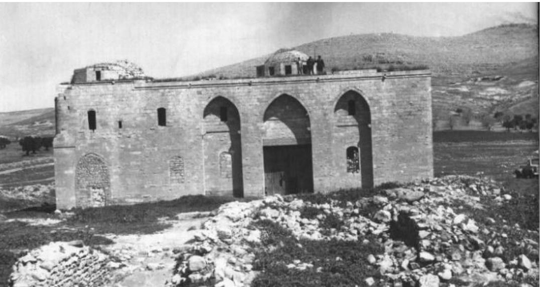 Figure 12: Photograph of Germus Village taken by Cihat Kirkctioglu in 1979 (Kirkctioglu, 2011  The most outstanding structure in the village is the church. Like the Armenian Church in the city centre of Urfa, this church is also dedicated to Surp Asdvadzadzin. The construction date of the church is not known for certain. About the church, the following information is recorded in the website of the Houshamadyan Association: “...there are records that the church was attacked, looted and set on fire in 1631. However, the Germus Armenians renewed the church in the same year. In the 19th century, during the reign of Archbishop Khoren Mekhitaryan (1823-1903), the old church was demolished and in 1881, a new church was built by the architect Hagop Ardzivian on the ruins of the old church" (Figure 12). 