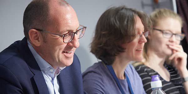 A man and two women having a meeting A man and two women having a meeting